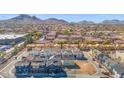 Expansive aerial view of a new residential community nestled against a backdrop of mountains at 16875 N 12Th St # 32, Phoenix, AZ 85022