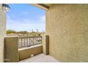 Balcony overlooking a residential area with palm trees on a sunny day at 18250 N Cave Creek Rd # 105, Phoenix, AZ 85032