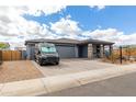 Attractive single-Gathering home with a paved driveway, a two-car garage, and a beautifully landscaped front yard at 2013 E Brooklyn Dr, Casa Grande, AZ 85122