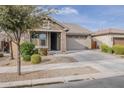 A lovely single-Gathering home boasts well-maintained landscaping and a spacious two-car garage at 22644 E Quintero Ct, Queen Creek, AZ 85142