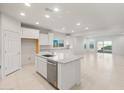 Bright kitchen with tile floors, stainless appliances, white cabinets, and granite countertops at 2649 N Riverside Dr, Florence, AZ 85132