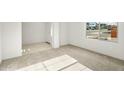 Neutral living room featuring carpeted floors, a window, and a front door at 2649 N Riverside Dr, Florence, AZ 85132