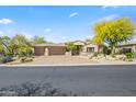 Inviting single-story home with a three-car garage and drought tolerant landscaping at 27582 N 67Th Way, Scottsdale, AZ 85266