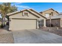 Beautifully maintained house with a two-car garage and manicured rock landscaping at 4558 W Joshua Blvd, Chandler, AZ 85226