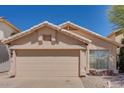 Front view of a single-Gathering home with a two-car garage and well-kept lawn at 4558 W Joshua Blvd, Chandler, AZ 85226