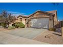 Single story home with well maintained gravel landscaping and a two car garage at 46072 W Barbara Ln, Maricopa, AZ 85139