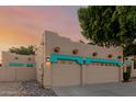 Side angle of a stucco Southwest-style home with a two-car garage and rock landscaping at 5345 E Mclellan Rd # 83, Mesa, AZ 85205