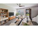 Bright living room with modern furniture, stylish rug, and open entryway at 6169 N Granite Reef Rd, Scottsdale, AZ 85250