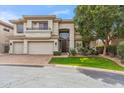 Stunning two-story home featuring a well-manicured lawn, three-car garage, and a grand entrance, exuding curb appeal at 6508 N 28Th St, Phoenix, AZ 85016