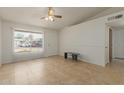 Inviting living room filled with natural light, showcasing tile floors and providing a comfortable living space at 6711 W Osborn Rd # 127, Phoenix, AZ 85033