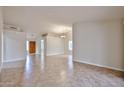 Spacious living area with tile flooring, neutral walls, and a bright, open floor plan at 8347 W Taro Ln, Peoria, AZ 85382