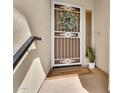 Charming condo entrance featuring a decorative screen door and welcome mat at 16800 E El Lago Blvd # 2072, Fountain Hills, AZ 85268