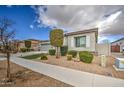 Single-story home featuring a landscaped yard and a neutral color scheme at 19736 E Emperor Blvd, Queen Creek, AZ 85142