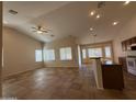 Spacious living room with tile floors open to the kitchen and breakfast nook at 2146 E Aloe Pl, Chandler, AZ 85286