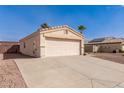 Well maintained single-story home featuring a two car garage and desert landscaping at 2177 S Weaver Dr, Apache Junction, AZ 85120