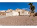 Charming single-story home showcasing a well-maintained yard and inviting facade at 2177 S Weaver Dr, Apache Junction, AZ 85120