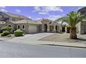 Charming single-story home featuring a well-manicured front yard and long driveway at 22346 N Goles Dr, Maricopa, AZ 85138