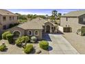 Well-maintained single-story home boasting a desert landscaped front yard and long driveway at 22346 N Goles Dr, Maricopa, AZ 85138