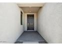 Welcoming front entrance with a dark wood door and textured walls for added curb appeal at 2707 E Abe Truckle Ave, San Tan Valley, AZ 85140