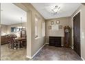 Spacious dining area with an adjacent living room, perfect for Gathering dinners and entertaining guests at 398 W Honey Locust Ave, San Tan Valley, AZ 85140