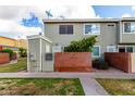 Charming townhome with brick accents, green shrubbery, and a lush lawn at 510 N Alma School Rd # 266, Mesa, AZ 85201