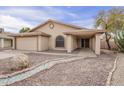 Beautiful single-story home with desert landscaping, rock yard and attached garage at 6433 W Beverly Ln, Glendale, AZ 85306