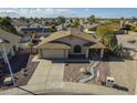 Attractive single-story home showcasing meticulous landscaping, a spacious driveway, and a charming covered porch entrance at 6433 W Beverly Ln, Glendale, AZ 85306