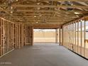 View into the garage of a home under construction showcasing its spaciousness and design at 7688 W Saddlehorn Rd, Peoria, AZ 85383