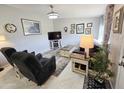 Cozy living room features comfortable seating, a television, and decorative accents creating an inviting atmosphere at 10624 W Oakmont Dr, Sun City, AZ 85351