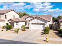 Single-story home with desert landscaping, fire hydrant visible on the street at 11207 N 165Th Ave, Surprise, AZ 85388