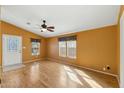 Bright living room featuring a ceiling fan and laminate flooring at 11596 W Sierra Dawn Blvd # 99, Surprise, AZ 85378