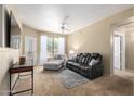 Inviting living room with plush seating, neutral tones, and natural light, creating a cozy atmosphere at 14950 W Mountain View Blvd # 5207, Surprise, AZ 85374