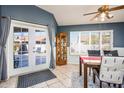 Cozy dining area featuring patio access, tile flooring, and modern furnishings at 1538 E Peach Tree Dr, Chandler, AZ 85249