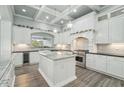 Bright kitchen featuring marble countertops, custom cabinetry, and stainless steel appliances at 2102 E Norwood St, Mesa, AZ 85213