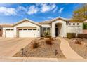 Charming single-story home with well-manicured landscaping and attached two-car garage at 2348 W Flint St, Chandler, AZ 85224