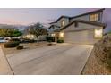 Lovely two-story home featuring manicured landscaping, a spacious driveway, and an attached two-car garage at 2708 E Desert Rose Trl, San Tan Valley, AZ 85143