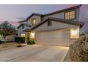 Lovely two-story home featuring manicured landscaping, a spacious driveway, and an attached two-car garage at 2708 E Desert Rose Trl, San Tan Valley, AZ 85143