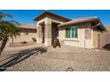 Close up of a beautiful single-story home's front entrance with brick accents and landscaped entrance at 3061 S Elderwood --, Mesa, AZ 85212