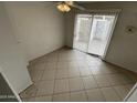 A charming dining area with modern tile floors and sliding doors to let the outside in at 3840 N 43Rd Ave # 73, Phoenix, AZ 85031