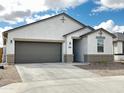 Beautiful single-story home with gray garage door, neutral stucco, and inviting curb appeal at 5463 E Azara Dr, San Tan Valley, AZ 85140