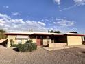 Charming single-story home with a brick facade, low-maintenance landscaping, and a two-car garage at 635 N 67Th Pl, Mesa, AZ 85205