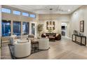 Spacious living room with high ceilings, modern lighting, and seamless indoor-outdoor living at 6576 E Whispering Mesquite Trl, Scottsdale, AZ 85266