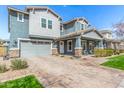 Beautiful two-story home boasts a paved driveway, inviting front porch, and lovely curb appeal at 7540 E Pampa Ave, Mesa, AZ 85212