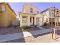 Charming two-story home featuring desert landscaping and a welcoming front porch at 7769 W Bonitos Dr, Phoenix, AZ 85035