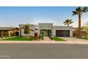 Beautiful home with a modern facade, desert landscaping, and a clear view of the inviting front entrance at 8319 E Columbus Ave, Scottsdale, AZ 85251