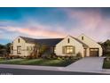 Elegant single-story home boasts a manicured lawn and a paved driveway leading to a two car garage at 10242 N 58Th St, Paradise Valley, AZ 85253