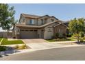 Inviting two-story home with a three-car garage, neutral exterior, and well-maintained landscaping at 10713 E Tesla Ave, Mesa, AZ 85212