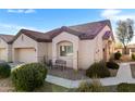 Charming home exterior with a well-maintained yard, desert landscaping, and a quaint front sitting area at 1475 N Agave St, Casa Grande, AZ 85122