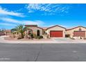 Inviting single-story home with stone facade, desert landscaping and a two-car garage at 19712 N Bridge Ct, Maricopa, AZ 85138