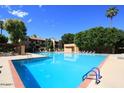 Large community pool area with plenty of seating and lounging space at 3031 N Civic Center Plz # 306, Scottsdale, AZ 85251